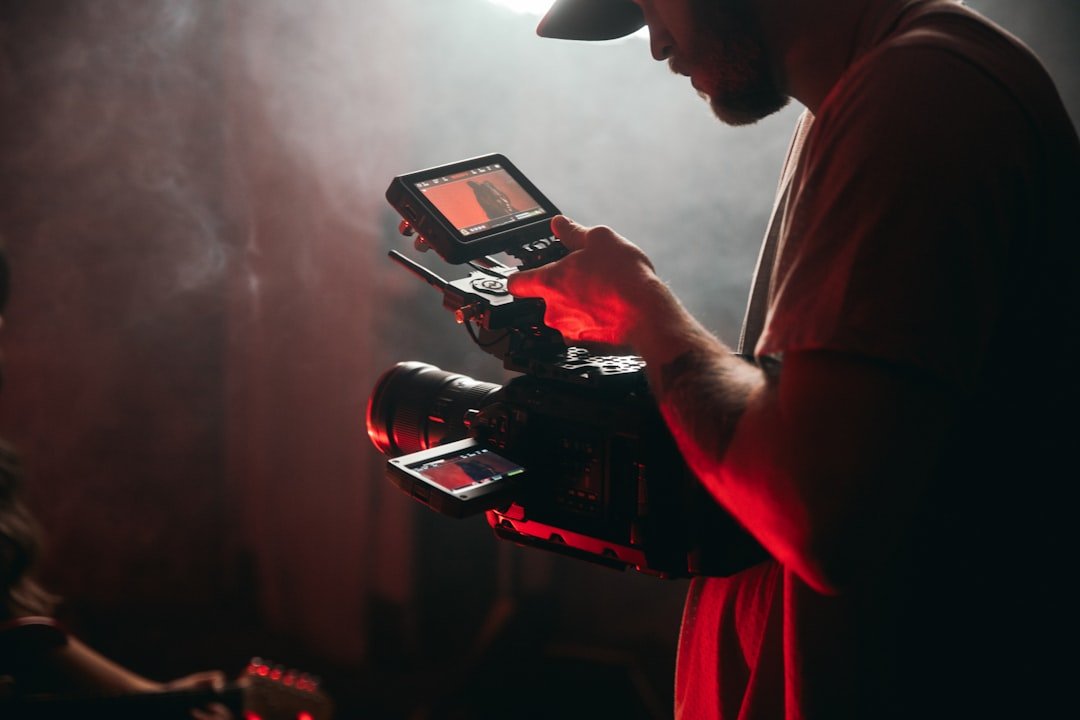 Menu man-in-white-t-shirt-holding-black-video-camera-dqmxihyx5ue